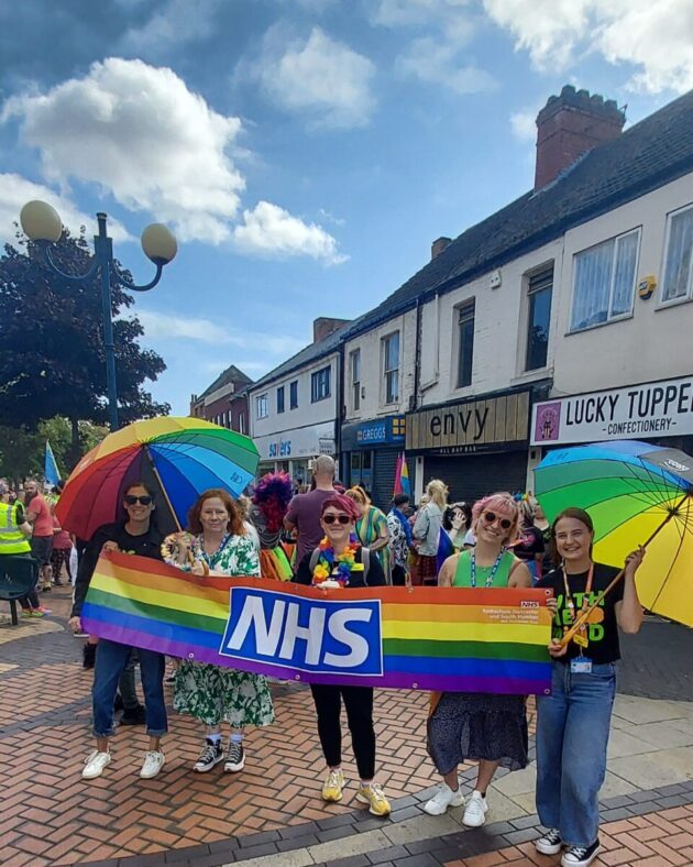People attending the Scunthorpe Pride with rainbow NHS flag
