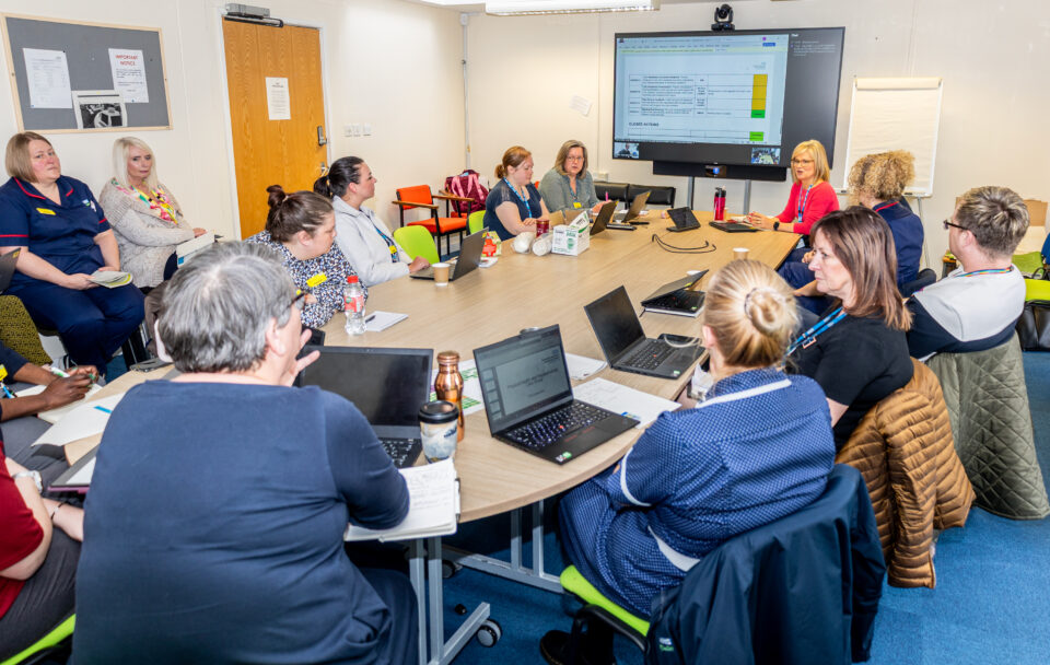 Staff getting ready for Care Quality Commission meeting