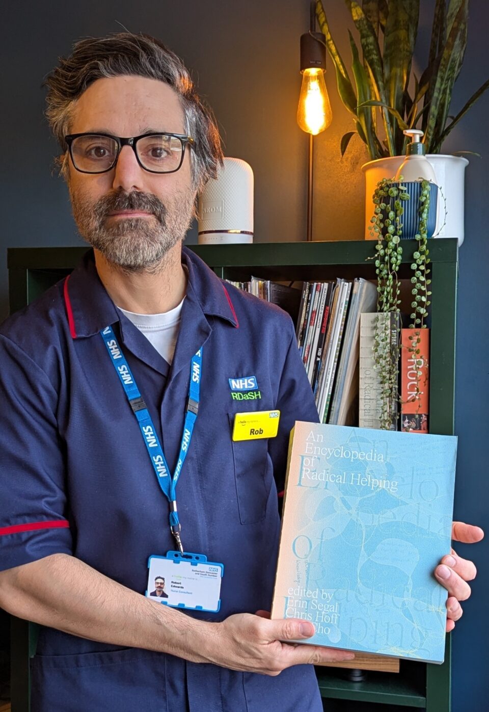 Rob Edwards proudly holding the book