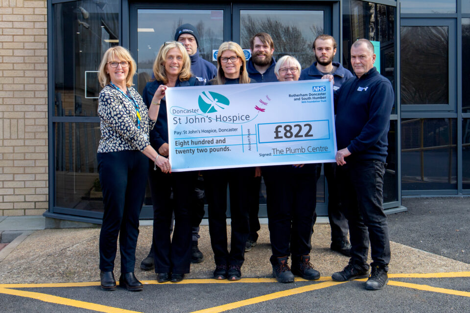 Presenting the cheque by Plumb Centre team