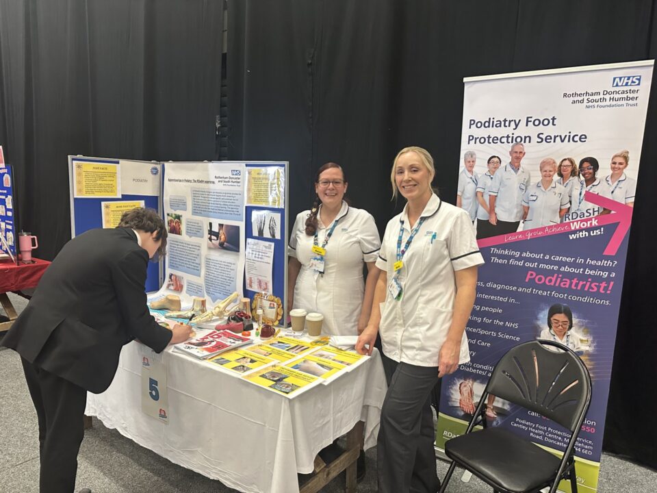 Three people at a stall