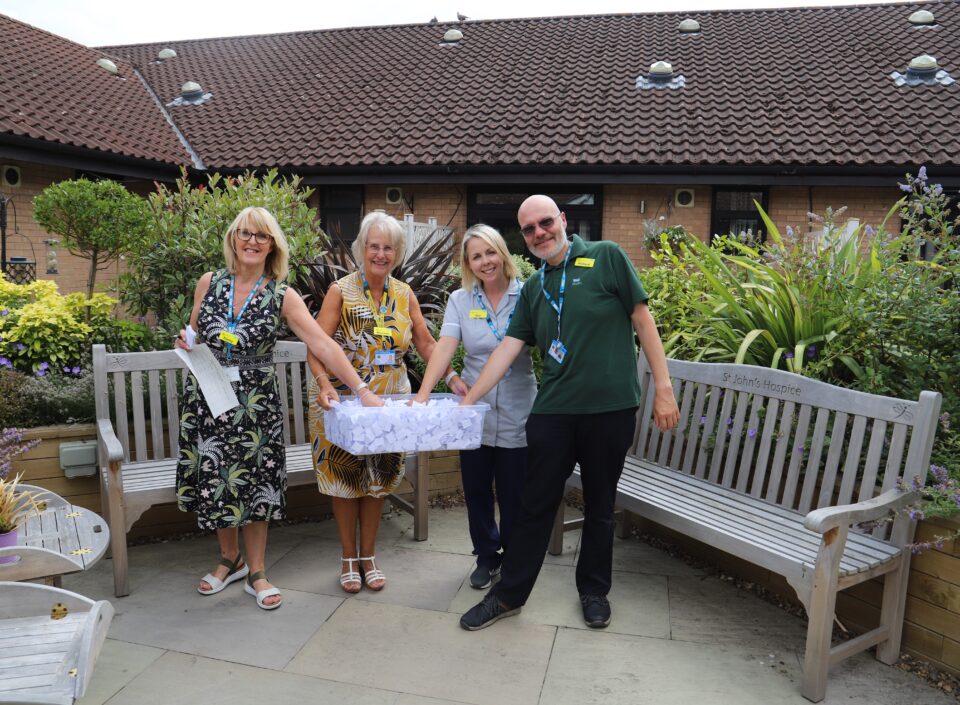 Four people with drawing a raffle