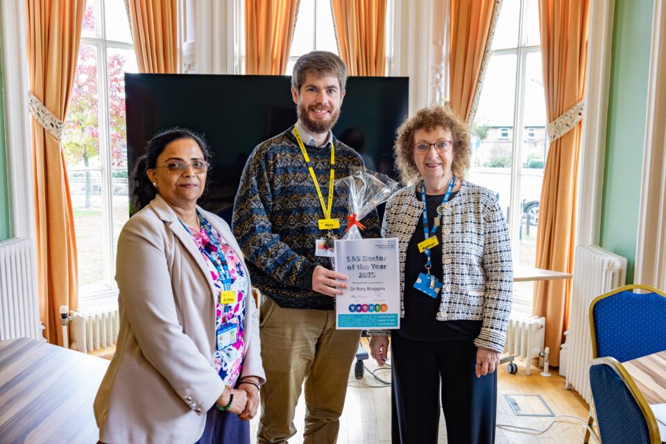 Rory being given the specialty and associate specialist doctors award 2025