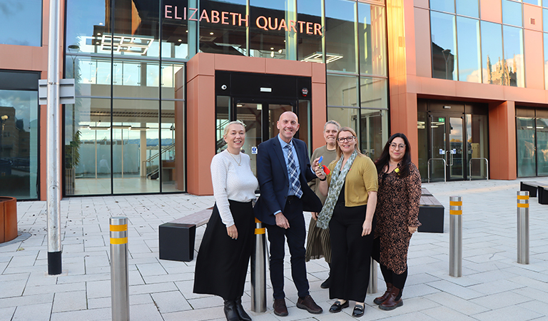 Elizabeth Quarter handing over the keys