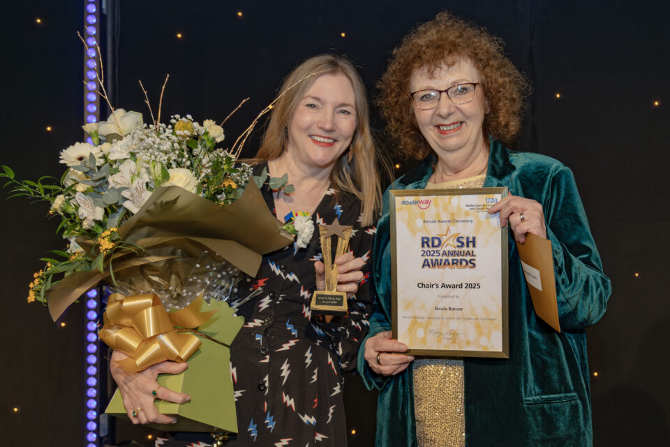 Nic Bonser receiving award from Kathryn Lavery