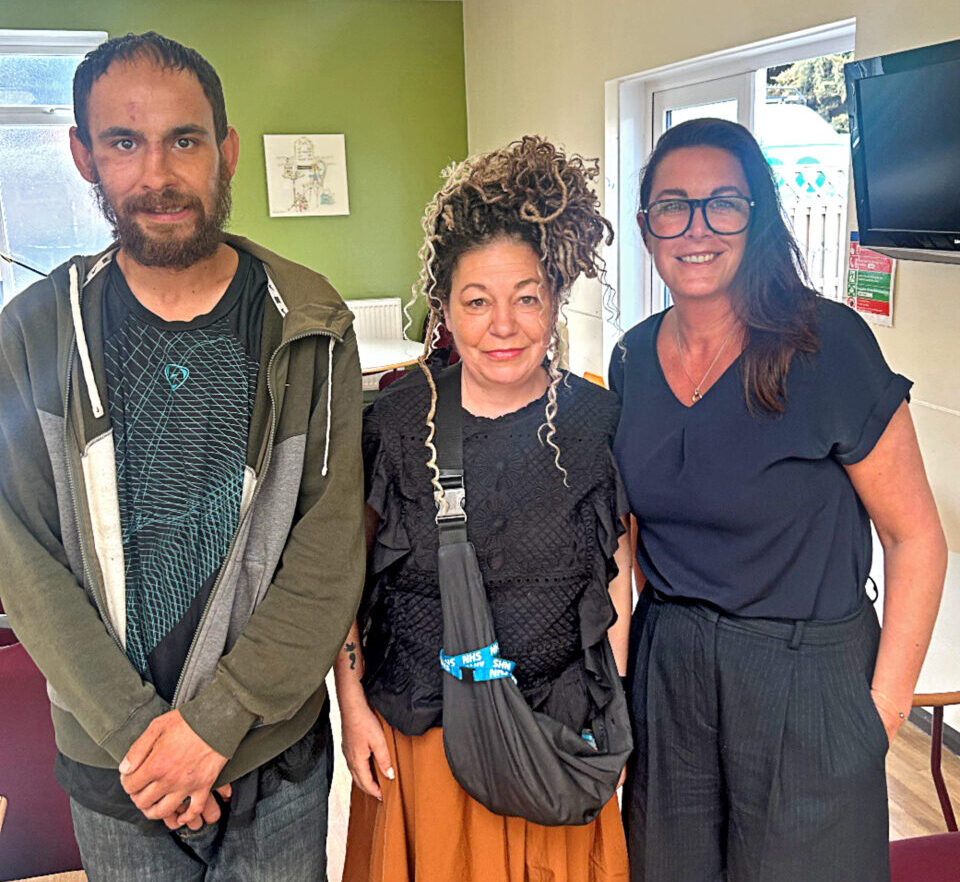 Alex with two women
