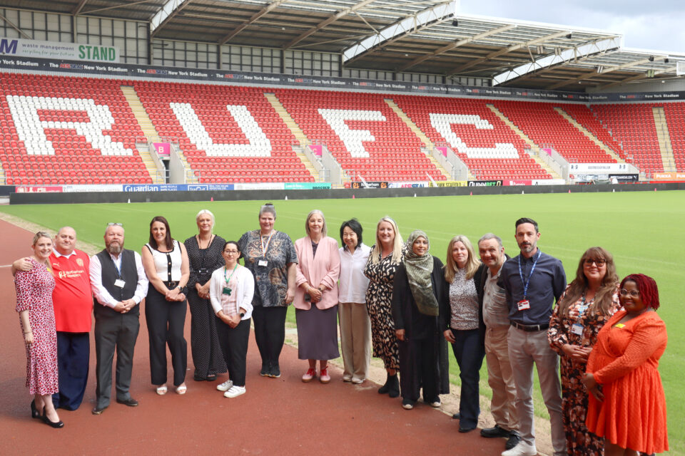 People stood inside the Rotherham United Football Club stadium